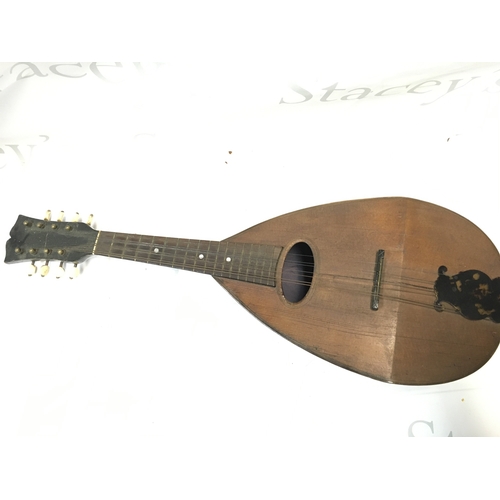 598 - A cased mandolin , 60cm long approximately