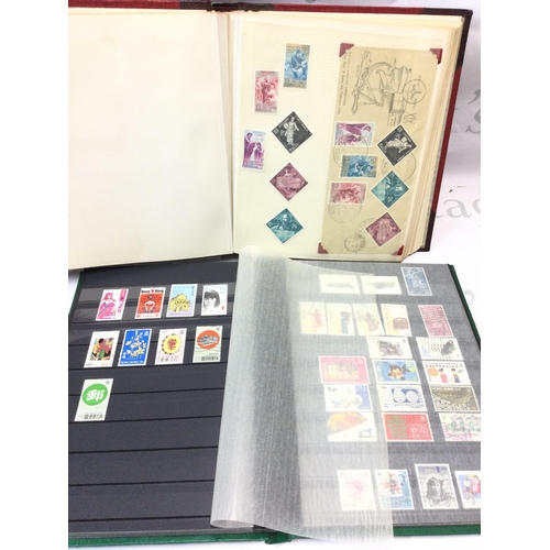 600 - A world stamp album containing stamps from Malta, Hong Kong, Churchman , Players cigarette cards