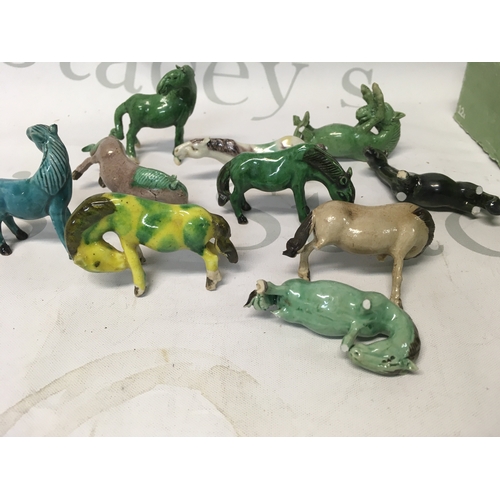 608 - A collection of miniature Chinese export Tang horses and 2 plate holders. Some legs are broken on th... 