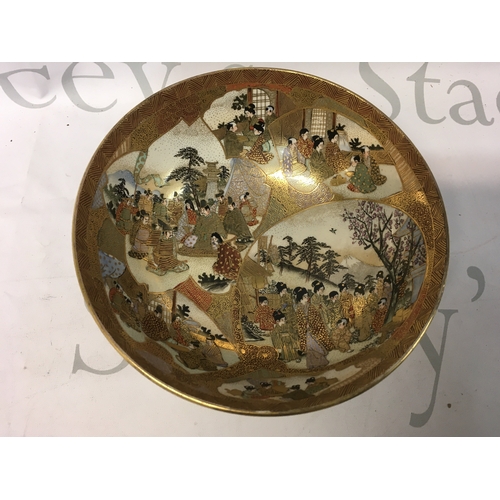 609 - A Satsuma ware bowl decorated with various figures and scenes, approx diameter 18cm.