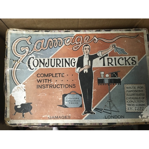 610 - A collection of antique toys and games including Gamages Conjuring Tricks, a battery operated Patrol... 