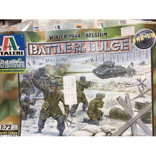 614 - A collection of toys including a boxed Italeri Battle of the Bulge model set, ATV and a model bike