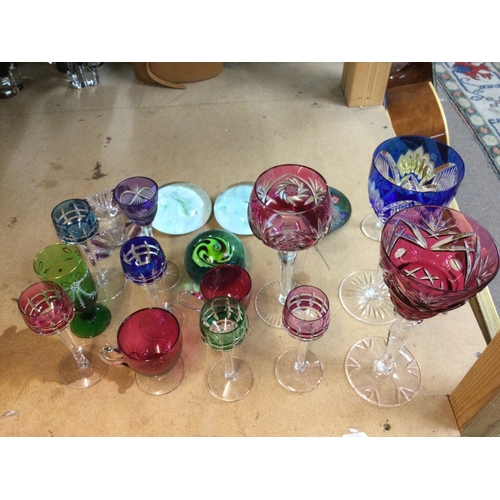 629 - A collection of coloured glasses, paperweights etc