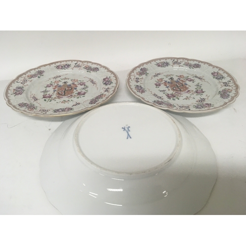 630 - A Meissen porcelain plate hand painted with sprays of flowers and a pair of Sampson Armorial plates ... 