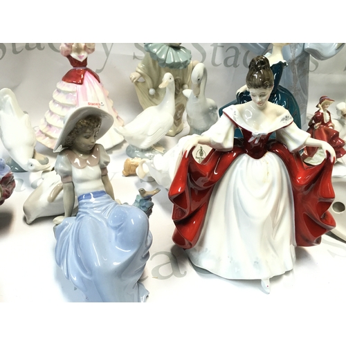 675 - A Collection of porcelain figures including Royal Doulton, Nao.