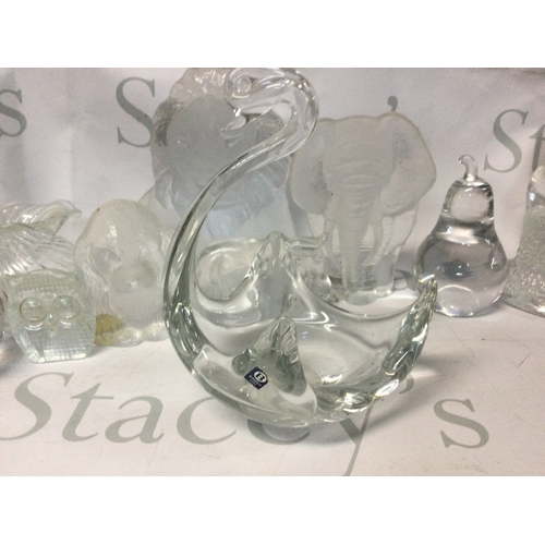 704 - A collection of glass decanters, glass items and glasses, some handmade and in the shape of animals.