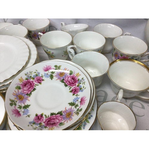 705 - A collection of Royal Albert, Queen Anne, Colclough, Richmond and other branded plates, mugs and mor... 