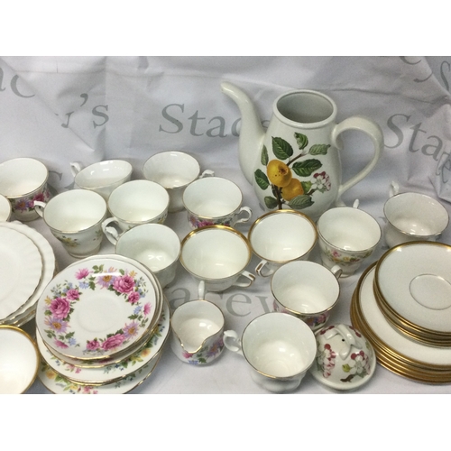 705 - A collection of Royal Albert, Queen Anne, Colclough, Richmond and other branded plates, mugs and mor... 