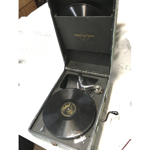 725 - A portable gramophone with Spankys Magic Piano records , seen working