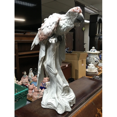 733 - A large Italian porcelain parrot figure, damaged. 52cm tall approximately