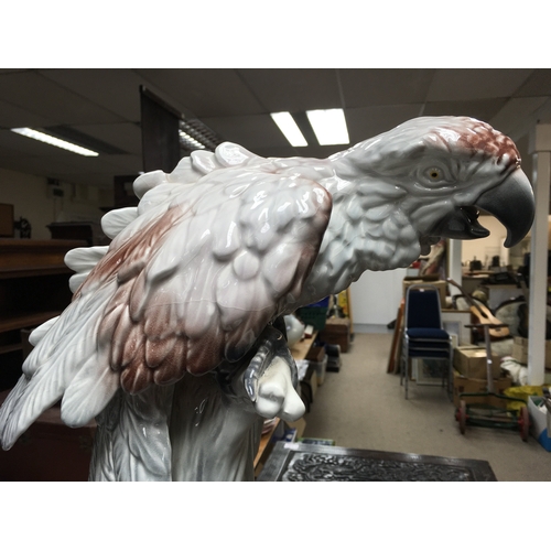 733 - A large Italian porcelain parrot figure, damaged. 52cm tall approximately