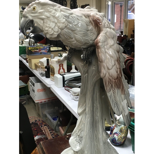 733 - A large Italian porcelain parrot figure, damaged. 52cm tall approximately