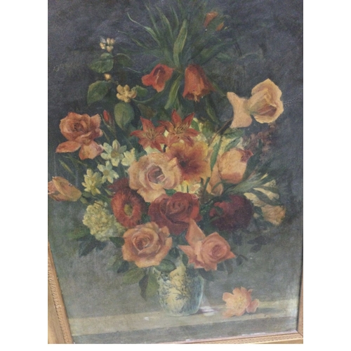 769 - A gilt framed still life oil painting of a vase of roses, dimensions 67x88cm.