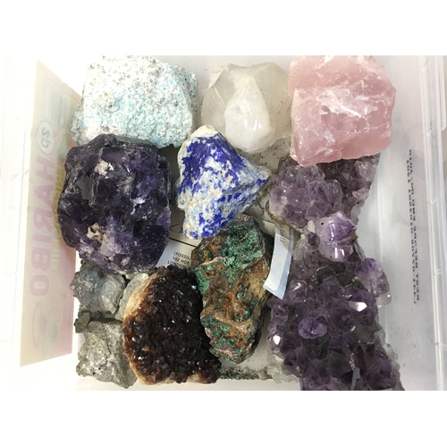 82 - A Collection of crystal rocks including amethyst, rose quartz , malachite etc