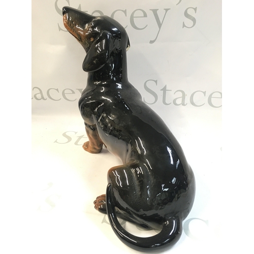 99 - A Beswick porcelain Dachshund dog , 26 cm tall 30cm long