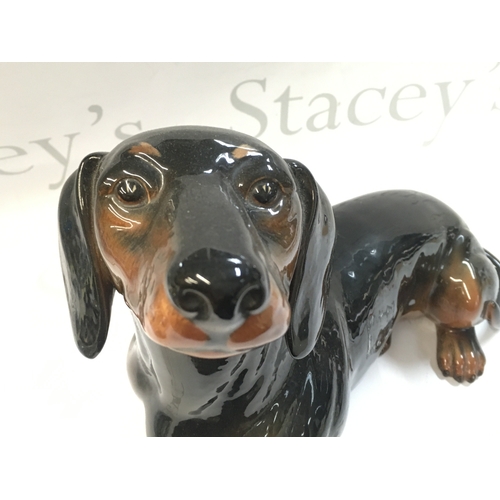 99 - A Beswick porcelain Dachshund dog , 26 cm tall 30cm long