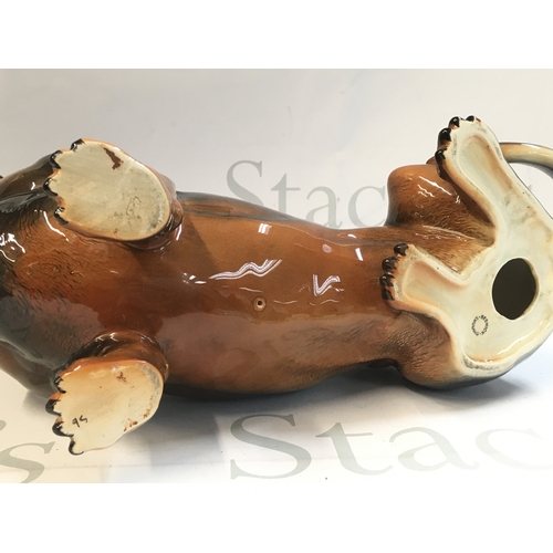 99 - A Beswick porcelain Dachshund dog , 26 cm tall 30cm long