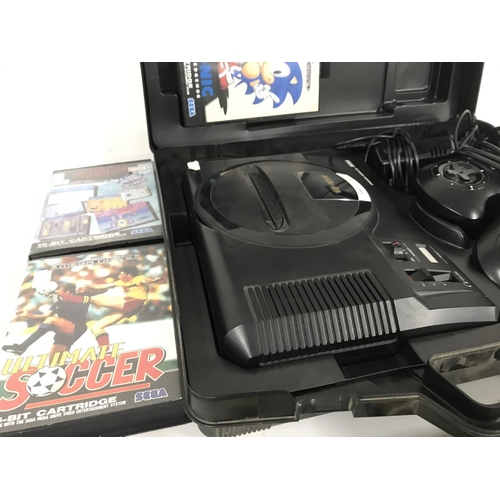 11 - A Sega mega Drive Console and a Collection of Games.