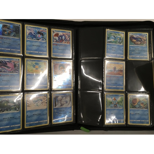 12 - A collection of modern pokemon cards, in 7 albums and a tin.