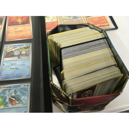 12 - A collection of modern pokemon cards, in 7 albums and a tin.