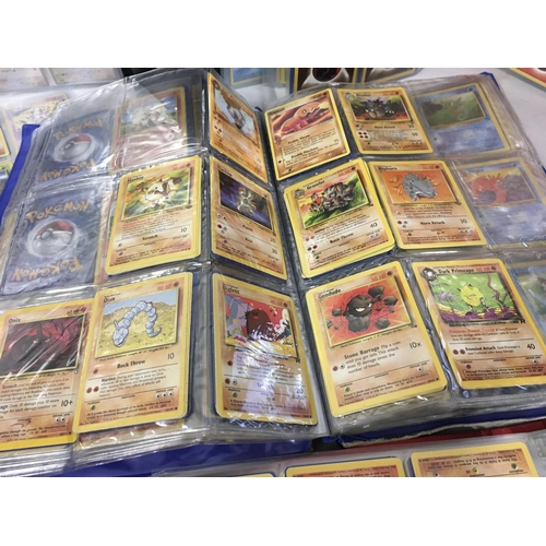 13 - A collection of 7 album sets containing numerous Pokemon cards.