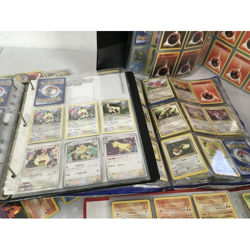 13 - A collection of 7 album sets containing numerous Pokemon cards.