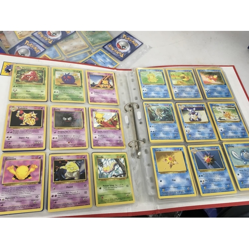 13 - A collection of 7 album sets containing numerous Pokemon cards.