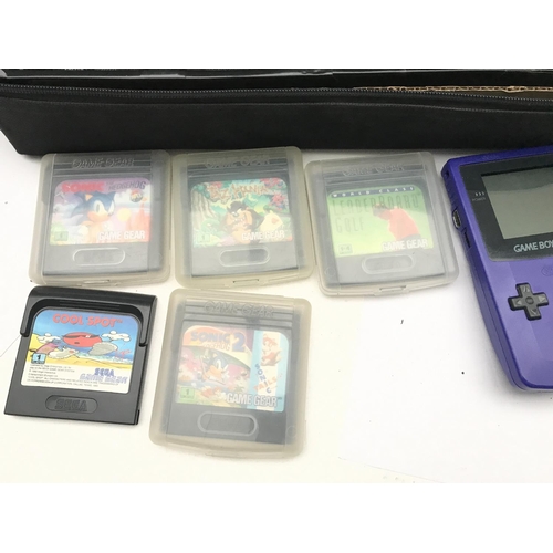 146 - A Seaga Game Gear With Games and a Nintendo Game Boy Color.