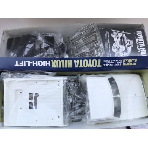 285 - A Boxed Tamiya Toyota Hilux Pick-Up Truck Radio Control Model Kit 1/10 Scale. No Reserve.