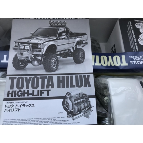 285 - A Boxed Tamiya Toyota Hilux Pick-Up Truck Radio Control Model Kit 1/10 Scale. No Reserve.