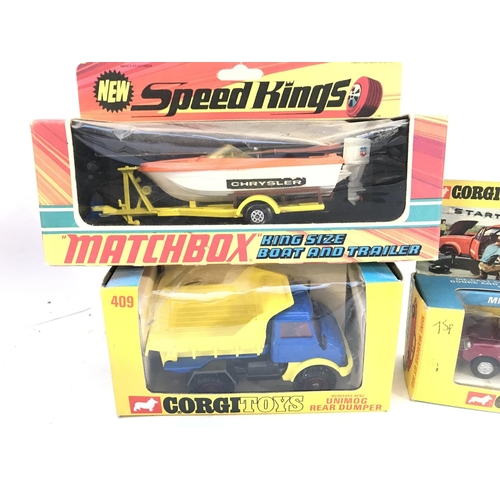 313 - A Boxed Corgi Unimog Rear Dumper #409. A Mini Marcos GT 850 and a Matchbox King Size Boat And Traile... 