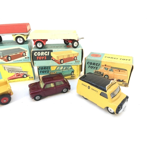 341 - A Collection of Boxed Corgi Toys. A Platform Trailer #101. A Dropside Trailer #100. A Massey-Ferguso... 