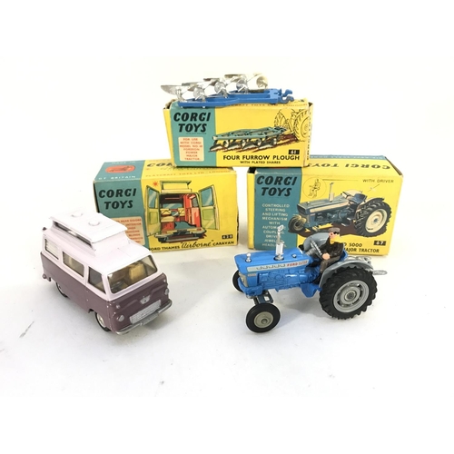 342 - A Boxed Corgi Ford Thames Airborne Caravan #420. A Ford 5000 Super Major Tractor #67 and a Four Furr... 