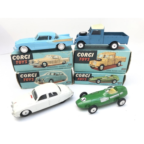 349 - A Boxed Corgi Studebaker Golden Hawk #211. A Land Rover #406. A Jaguar 2.4 Litre Saloon #208 and a V... 