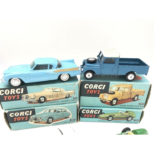 349 - A Boxed Corgi Studebaker Golden Hawk #211. A Land Rover #406. A Jaguar 2.4 Litre Saloon #208 and a V... 