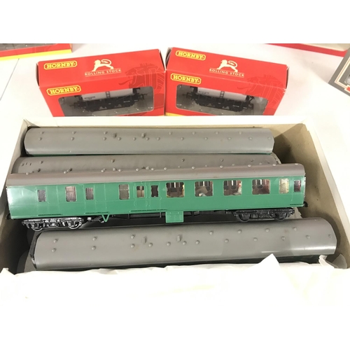 42 - A Collection of Boxed And Loose 00 Gauge Wagons and Coaches.