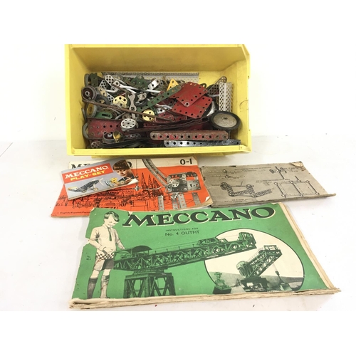 475 - A collection of Meccano pieces and instruction booklets. No reserve