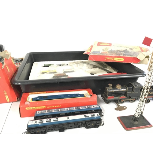 477 - A collection of both clockwork and electric model railway locomotives and accessories, primarily 00 ... 