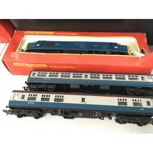 477 - A collection of both clockwork and electric model railway locomotives and accessories, primarily 00 ... 