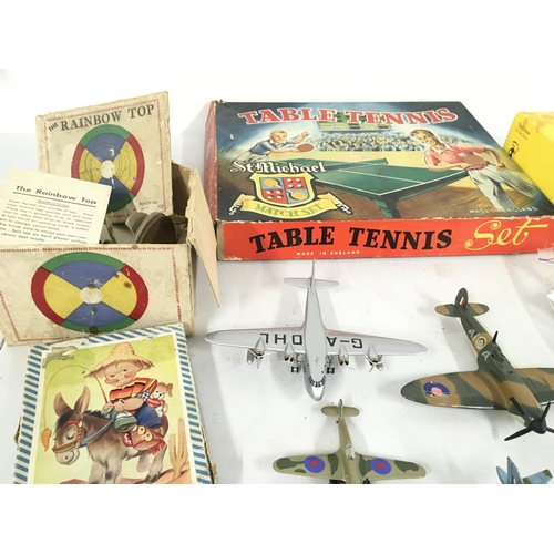 478 - A collection of assorted toys including Table Tennis..Dominoes..puzzle..vintage Rainbow Top. Also in... 