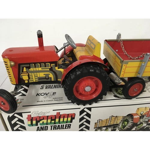 479 - A boxed Fetor clockwork Tractor and Trailer . No key. No reserve