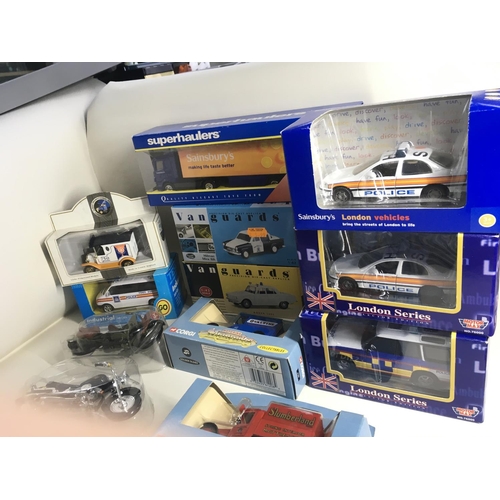 487 - A collection of 13 boxed diecast model vehicles by Corgi..Vanguard and others. Includes two plastic ... 