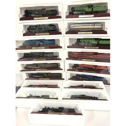 496 - A Collection of 17 Boxed Atlas Model Trains with Magazines.