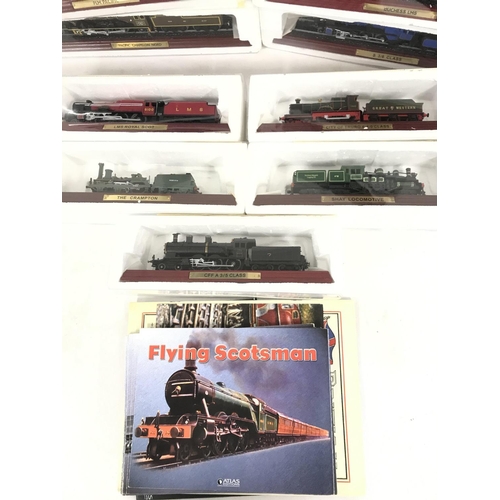 496 - A Collection of 17 Boxed Atlas Model Trains with Magazines.