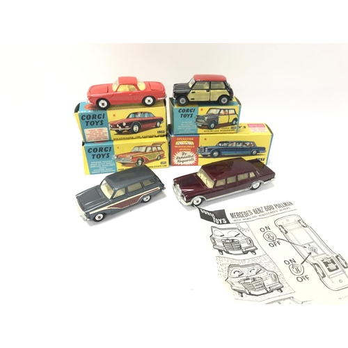 63 - 4 Boxed Corgi Vehicles. A Volkswagen 1500 Karmann Ghia #239. A Mini-Cooper #249. A Ford Consul Corti... 