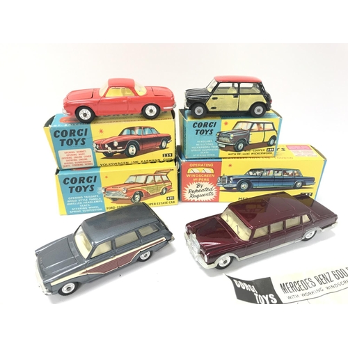 63 - 4 Boxed Corgi Vehicles. A Volkswagen 1500 Karmann Ghia #239. A Mini-Cooper #249. A Ford Consul Corti... 