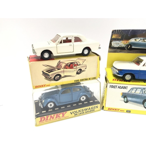 69 - A Boxed Dinky Ford Cortina De Luxe #159. A Volkswagen De Luxe Saloon #129 and a B.M.W 2000 Toluca #1... 