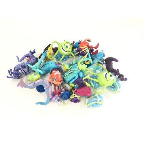 709 - A box containing a quantity of Monsters Inc toys and figures. NO RESERVE