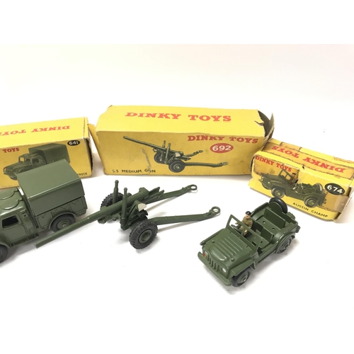 79 - 4 Boxed Dinky Military Vehicles. A Armoured Personnel Carrier #676. A Army 1-ton Cargo Truck #641. A... 