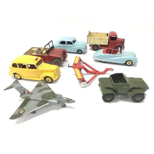 82 - A Small Collection of Playworn Dinky Toys.